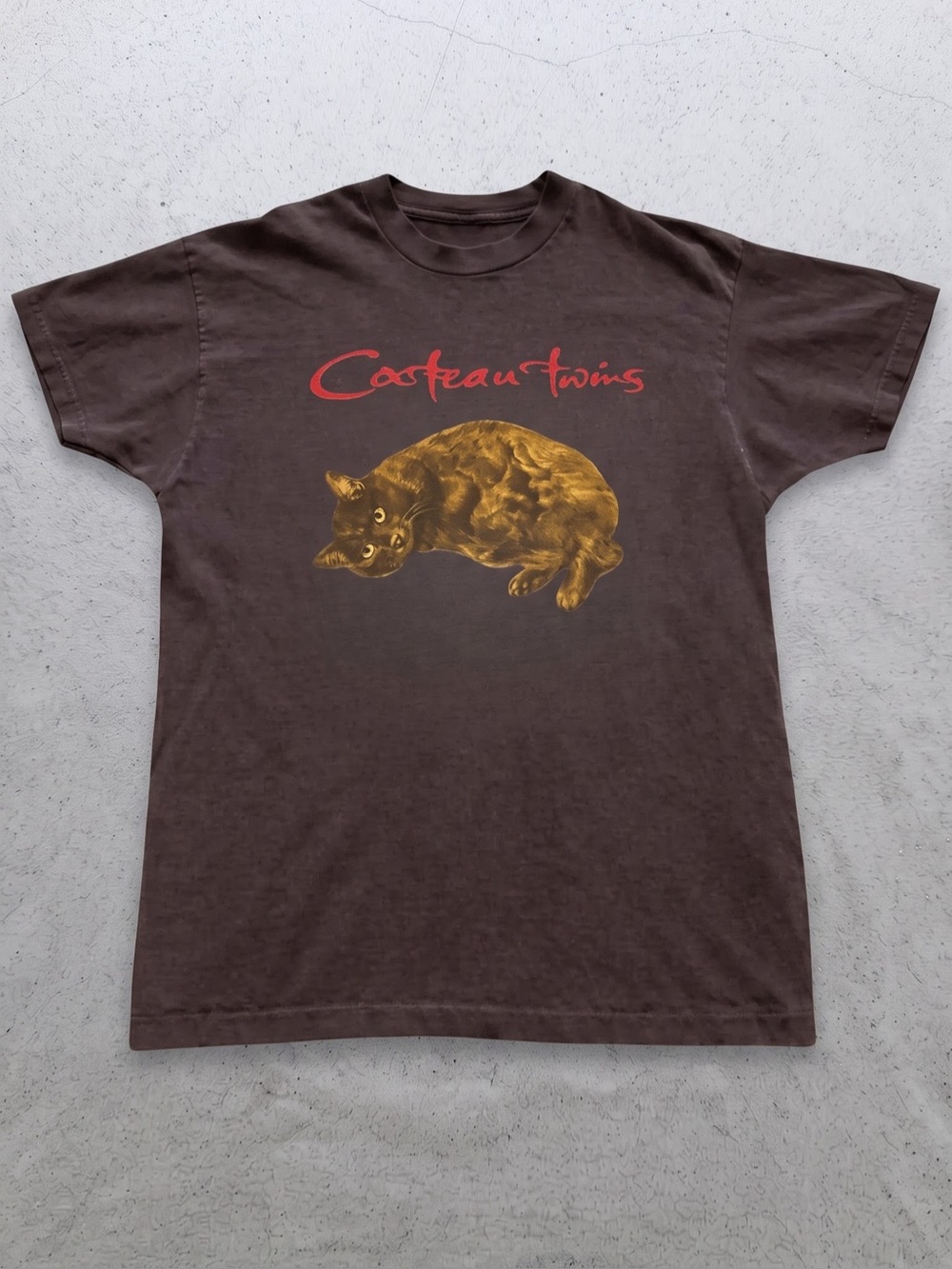 Cocteau Twins Black Tee with Red Logo &
Gold Cat Graphic